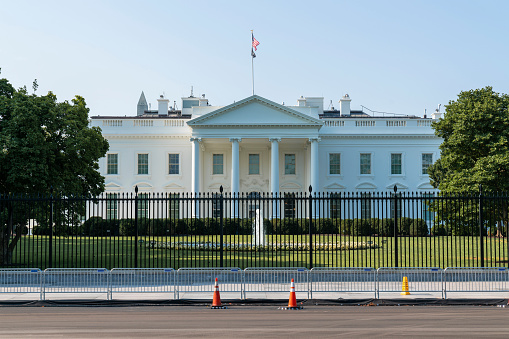 The iconic view of The North Portico of The White House on sunny day, Washington DC, USA. The concept of executive branch of American political system. President administration