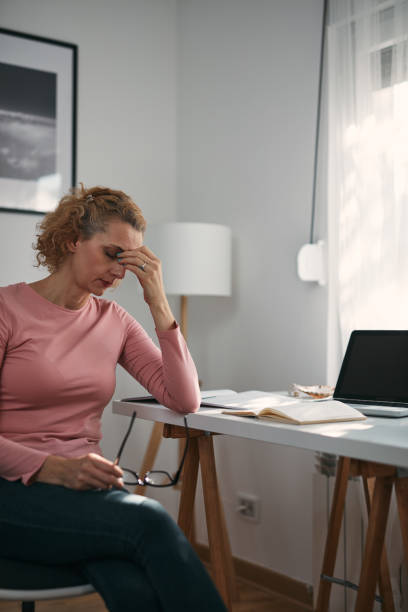istock Woman with eyes hurting, sinus problem, headache, head pain, working from home troubles and issues. 1359493643