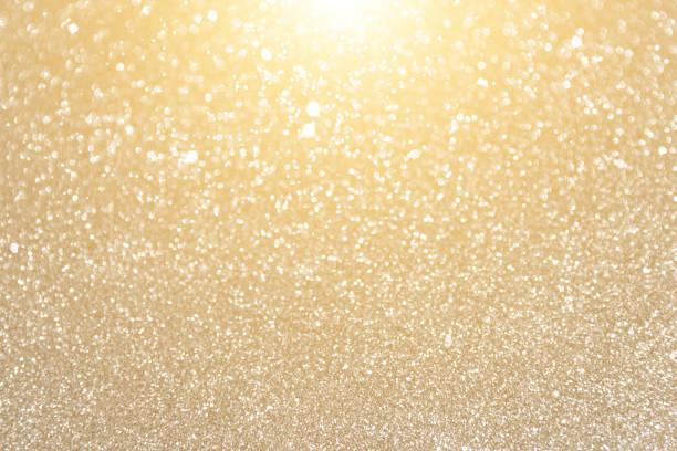 istock Glitter sparkling gold bokeh background 1359495659