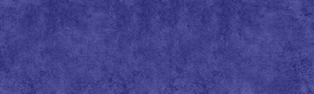 istock 2022 year color Very Peri abstract wide textured background. Dark colour wall panoramic texture 1359497008