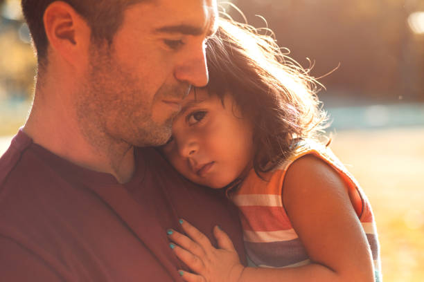 istock Happy father playing with his daughter in park. 1359497260