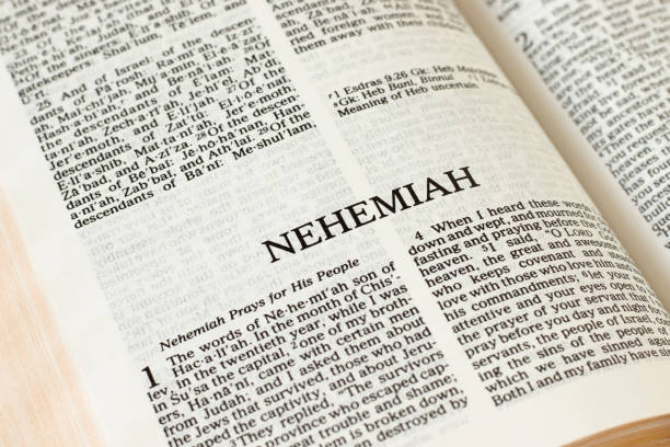 Nehemiah Bible open Book Holy Christian Scripture Old Testament stock photo