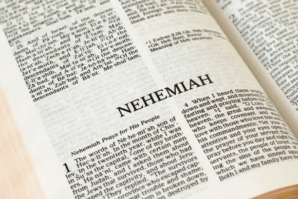Nehemiah Bible open Book Holy Christian Scripture Old Testament. Biblical concept. Pages of the Word of God and Jesus Christ written in English. A close-up.