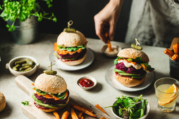 istock Vegan food dinner preparations  with beet patties and vegetables 1359499289