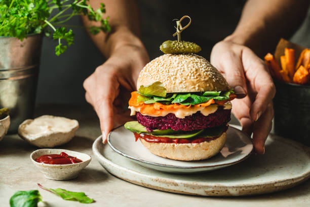 istock Serving a mouth watering vegan beet burger with a pickle 1359499510