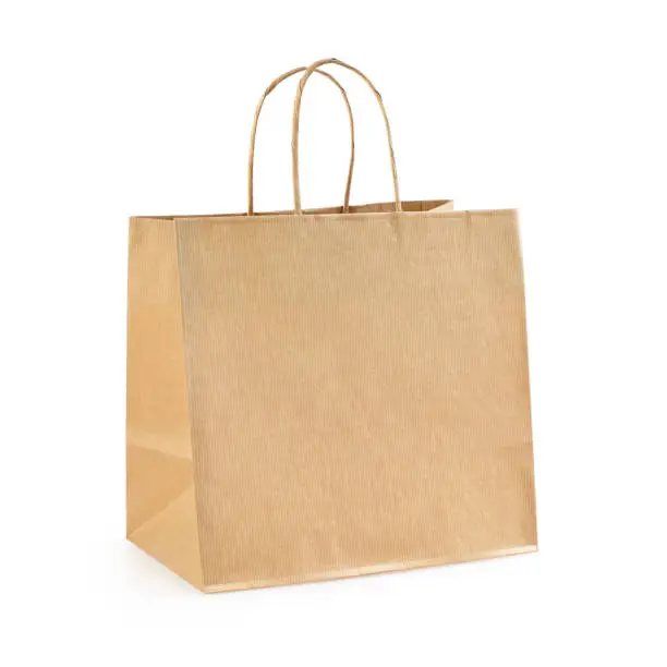 Paper shopping bag. Eco friendly biodegradable packing bag isolated on white background. Clipping path included.