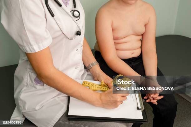 Childhood Obesity Problem Fat Boy At A Nutritionist Appointment Stock Photo - Download Image Now
