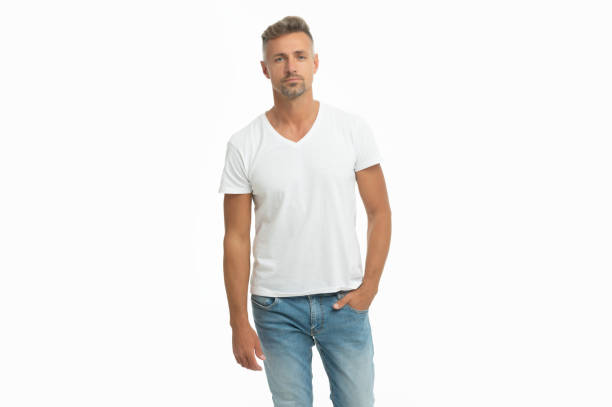 istock Serious handsome man in casual tshirt keep hand in pocket isolated on white, guy 1359503791