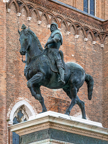 Close-up of St. Michael the Archangel and the facade of Chiesa di San Michele in Foro, Lucca, Italy