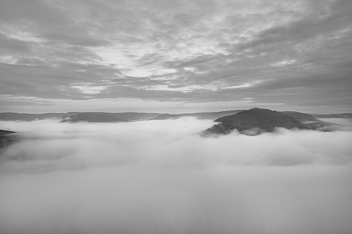 Fog rising on the mountains of the small Saar loop. mystical silence on the river Saar in Saarland.