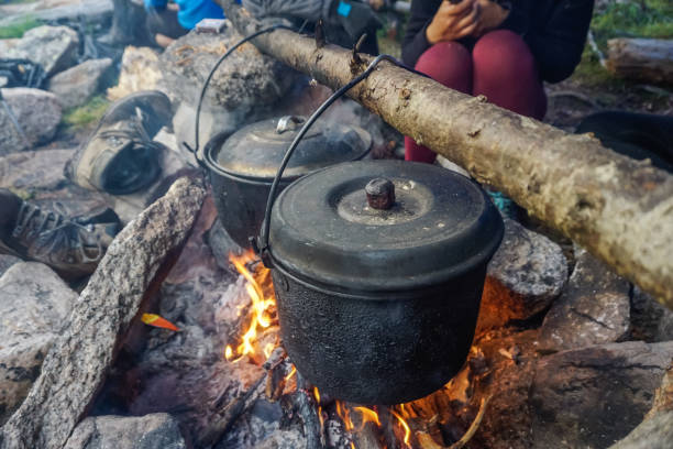 istock Cooking in a pot over a fire in the taiga 1359507228