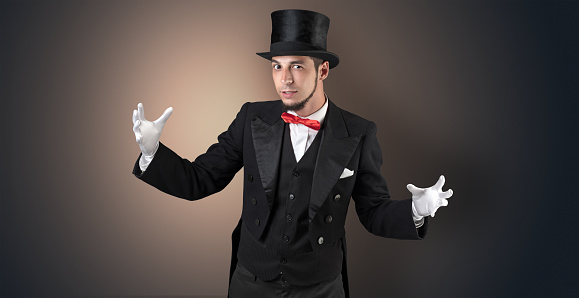 Handsome magician with no graph holds something invisible