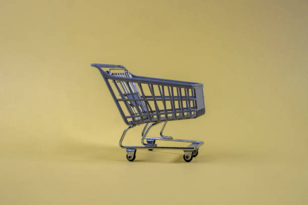 istock Shopping cart on a yellow background 1359507641