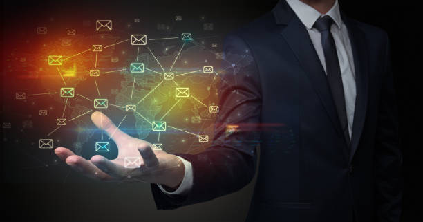 istock Businessman holding communication symbols 1359507642