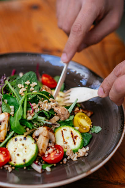 istock Eating Vegan Salad in Eco-Friendly Restaurant 1359508234