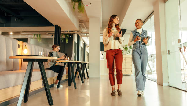 Young businesswomen walking through a modern office