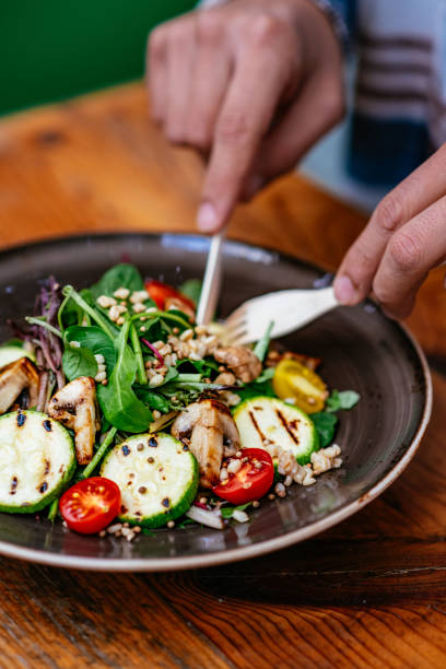 istock Eating Vegan Salad in Eco-Friendly Restaurant 1359508594