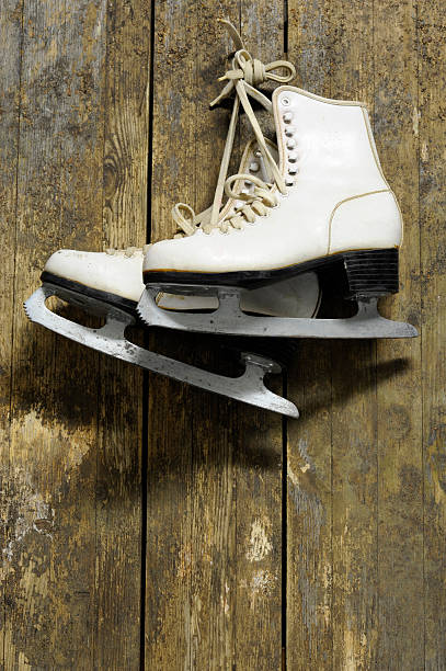 istock ice skates hanging on an old weathered wooden wall 135950861