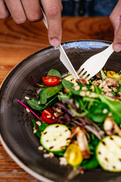 istock Eating Vegan Salad in Eco-Friendly Restaurant 1359508719