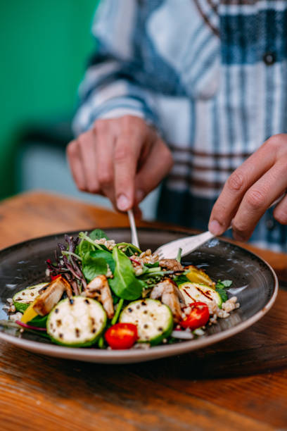 istock Eating Vegan Salad in Eco-Friendly Restaurant 1359509900