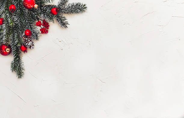 istock Christmas light background, fir branches with red berries. 1359510002