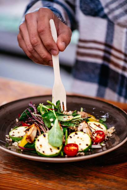 istock Eating Vegan Salad in Eco-Friendly Restaurant 1359510006