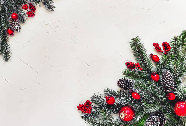 istock Christmas light background, fir branches with red berries. 1359510045