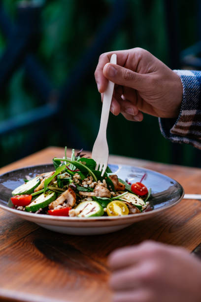 istock Eating Vegan Salad in Eco-Friendly Restaurant 1359510100