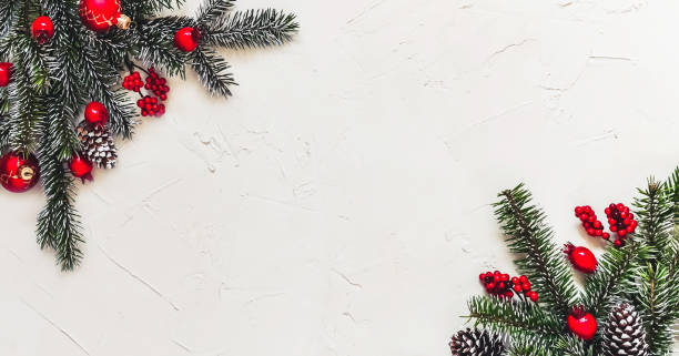 istock Christmas light background, fir branches with red berries. 1359510101