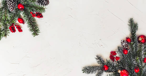 istock Christmas light background, fir branches with red berries. 1359510102