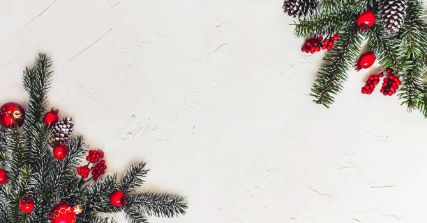 istock Christmas light background, fir branches with red berries. 1359510115