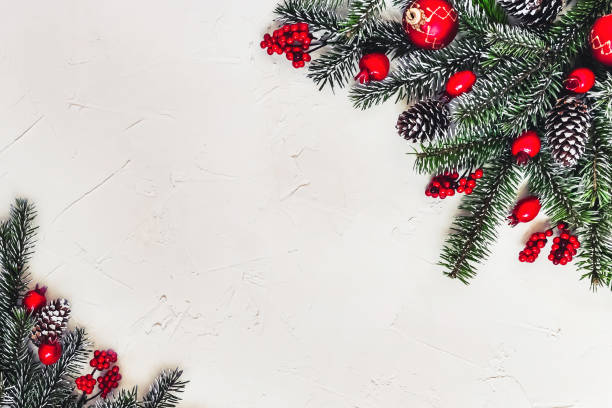 istock Christmas light background, fir branches with red berries. 1359510125