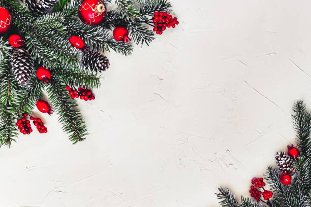 istock Christmas light background, fir branches with red berries. 1359510129