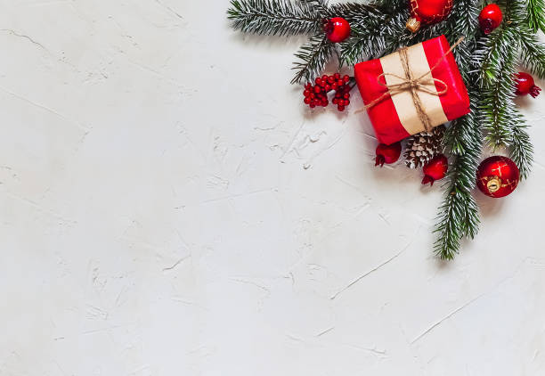 istock Christmas light background, fir branches with red berries. 1359510142