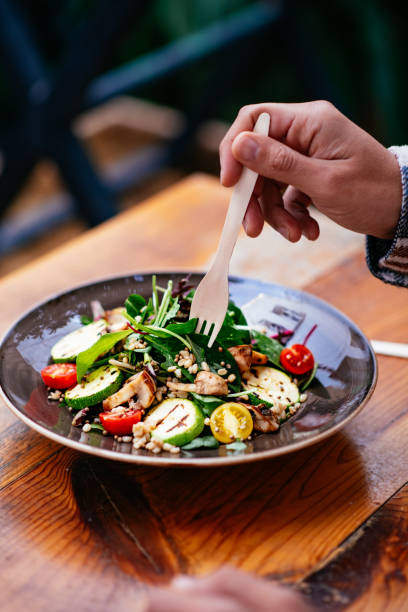 istock Eating Vegan Salad in Eco-Friendly Restaurant 1359510952
