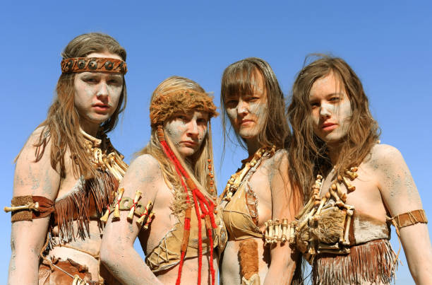 istock Dirt Covered Neanderthal Women Standing Together 1359511062
