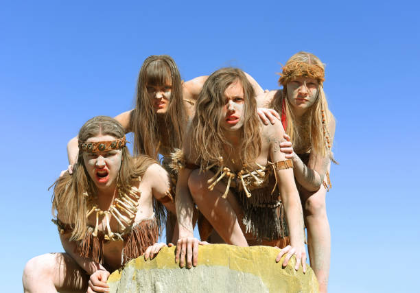 istock Dirt Covered Neanderthal Women Standing Together 1359511095