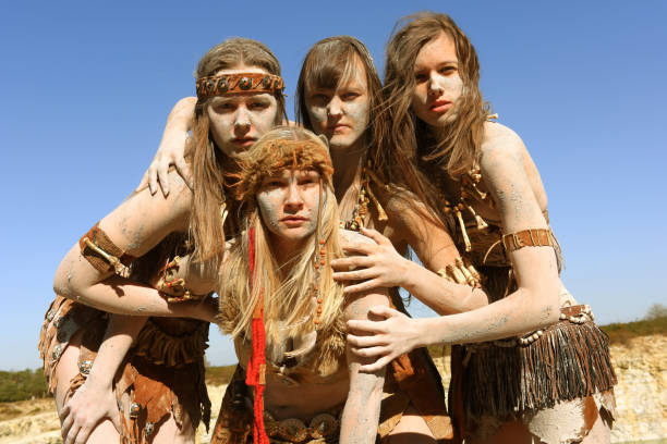 istock Dirt Covered Neanderthal Women Standing Together 1359511101