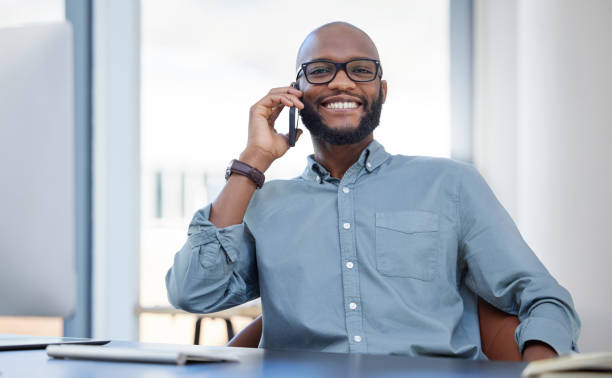 istock Shot of a young businessman using a smartphone in a modern office 1359512290