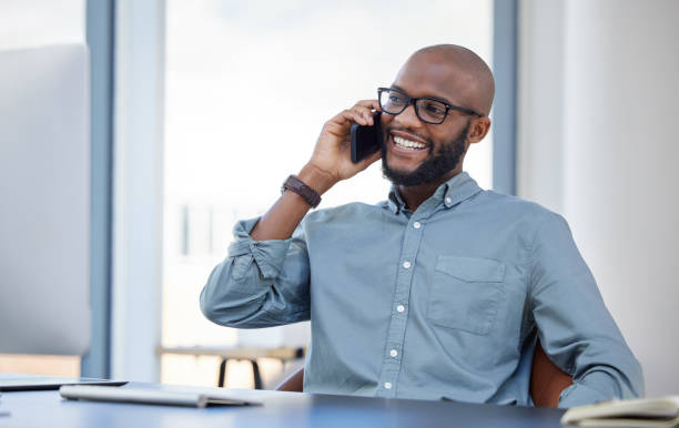 istock Shot of a young businessman using a smartphone in a modern office 1359512294