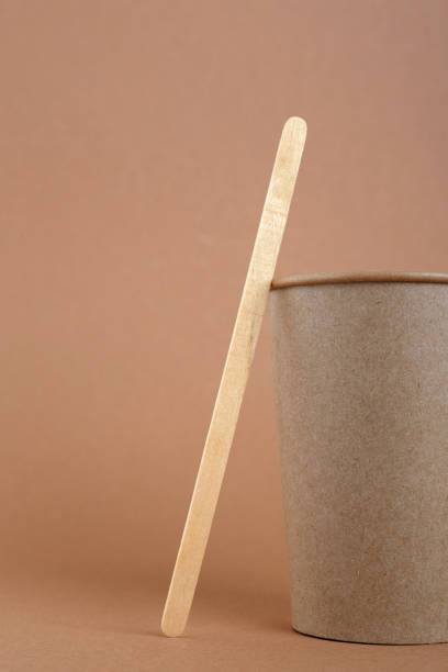 istock Disposable kraft paper cup nd wooden coffee stick 1359512376