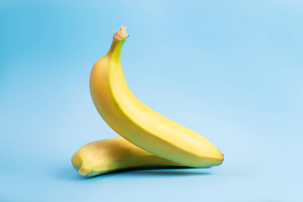 istock Banana levitation. Two yellow bananas on a blue background. 1359515870