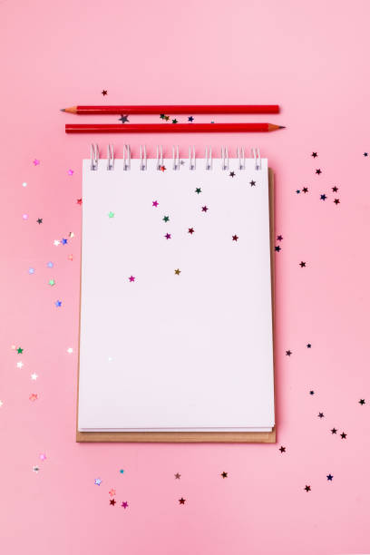 istock Blank Notepad and Red Pencils on Pink Background Vertical Copy Space Business Concept 1359518551