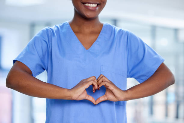 istock Shot of an unrecognizable doctor making a heart shape with their hands at work 1359518711