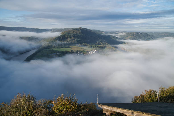 istock Fog rising on the mountains of the small Saar loop 1359519641