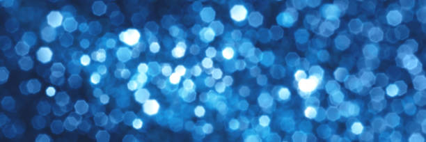 istock Blue sparkling glitter bokeh background banner 1359519720