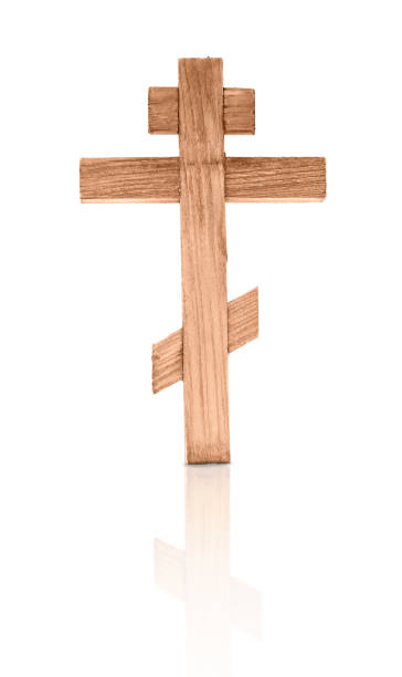 istock Wooden isolated cross on a white background. 1359520074