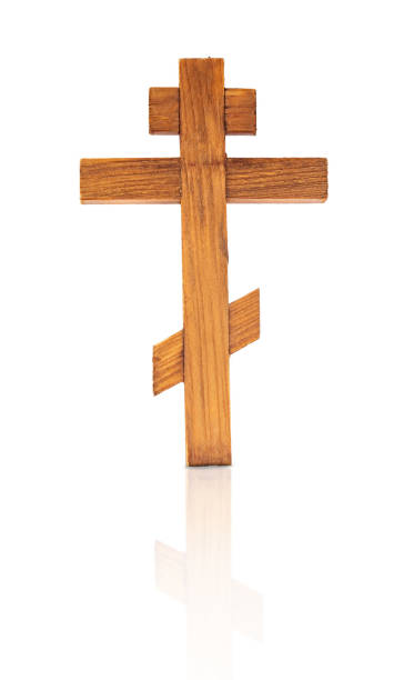 istock Wooden isolated cross on a white background. 1359520078