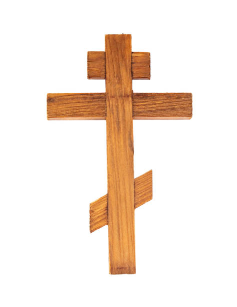 istock Wooden isolated cross on a white background. 1359520084
