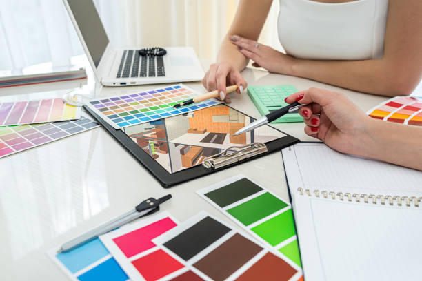 istock two  girls student designers working on their first design project and choosing a color. 1359520461
